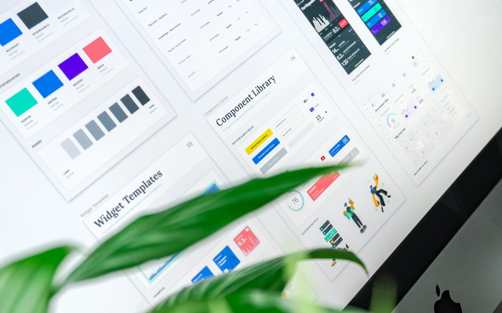 A design system displayed on a computer screen, showing color palettes, type scales, and a component library.
